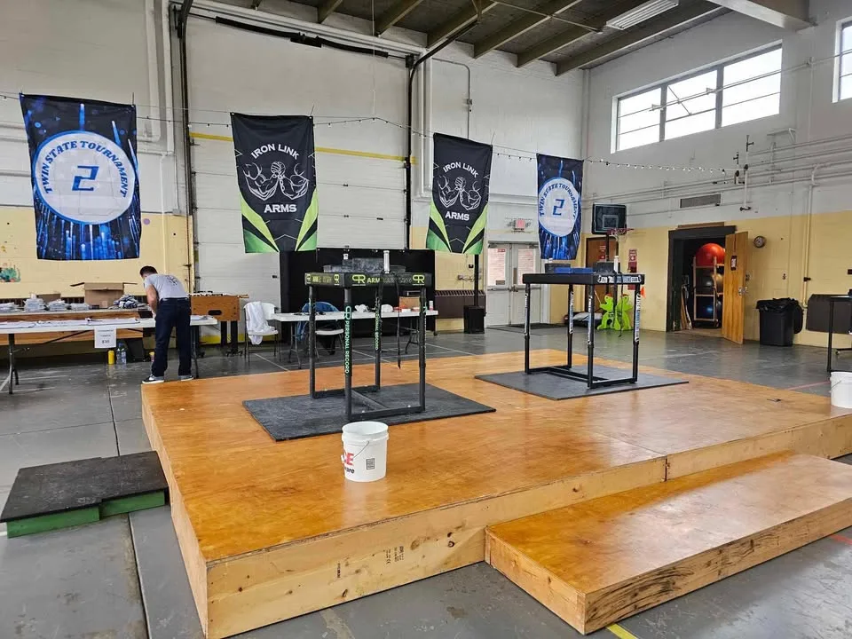 The arm wrestling tables set up for an event
